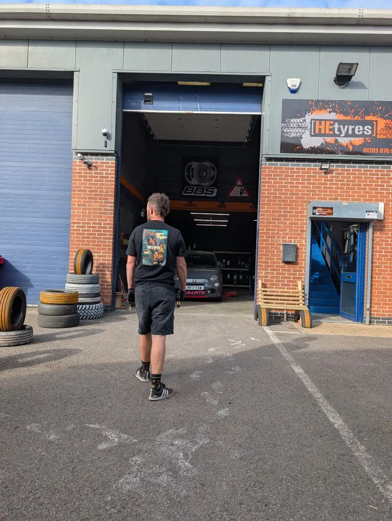 Outside the HEtyres depot in Swindon with a car on the ramp inside