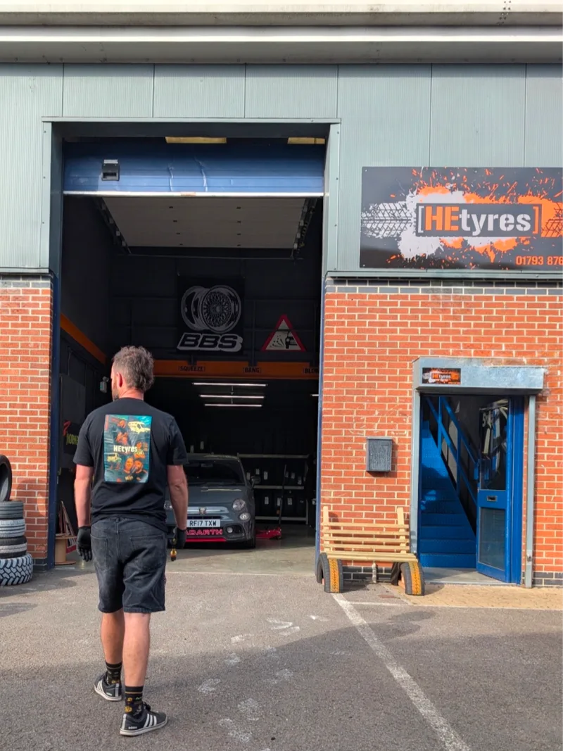 Howie walking into the HEtyres depot workshop